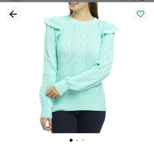 Light mint colored sweater.